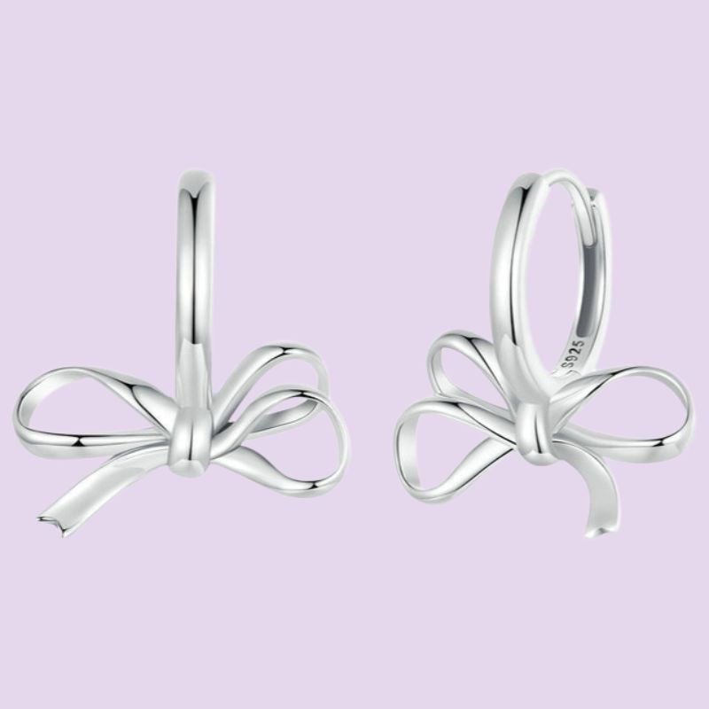 silver bow dangling earrings