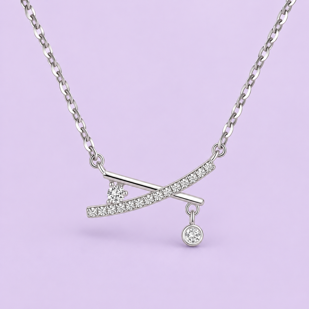X-Cross Studded Pendant Necklace product detail on lavender studio background