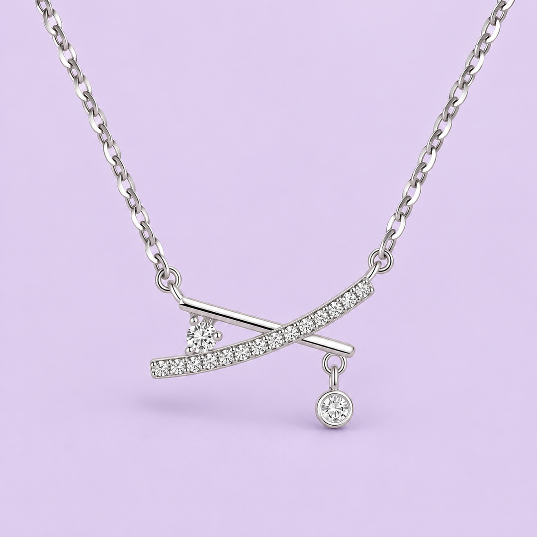 X-Cross Studded Pendant Necklace product detail on lavender studio background